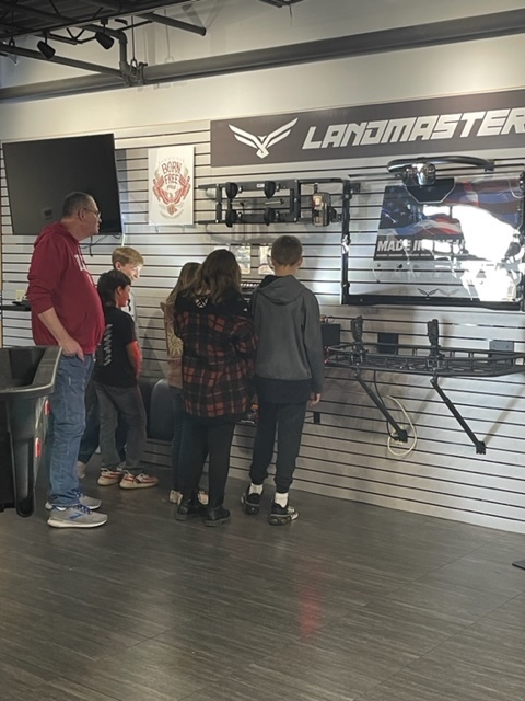 Students interact with American Landmaster's showroom. 