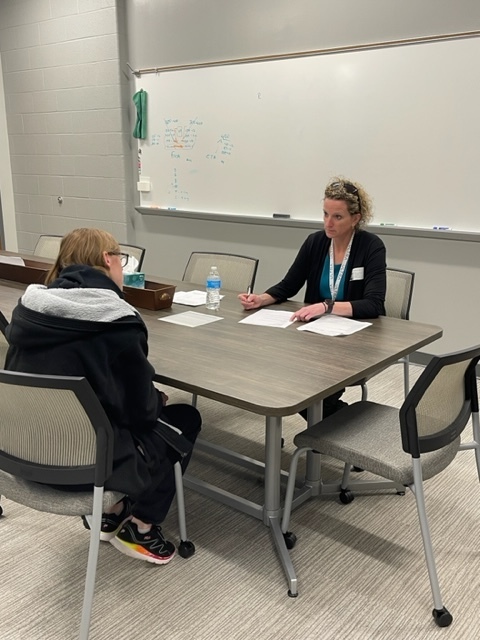 Rachel Patrick interviews a student.