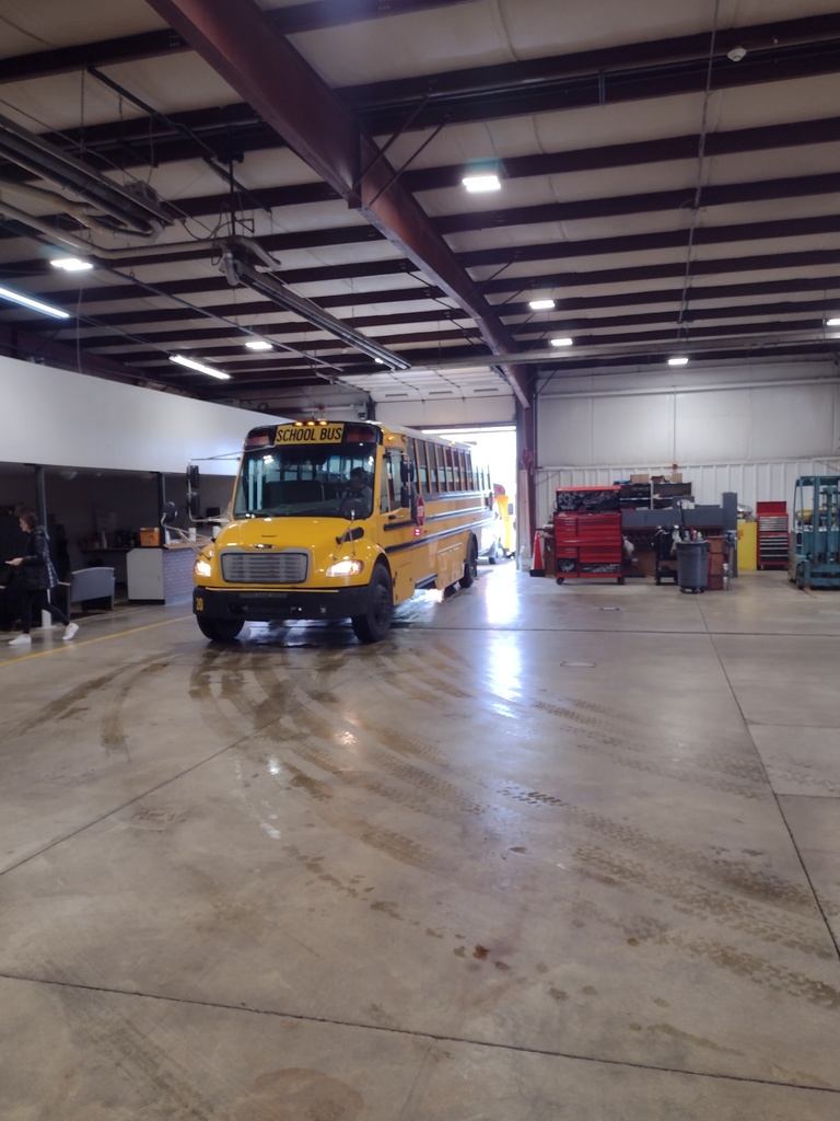 Bus pulls into the bus barn for inspection.