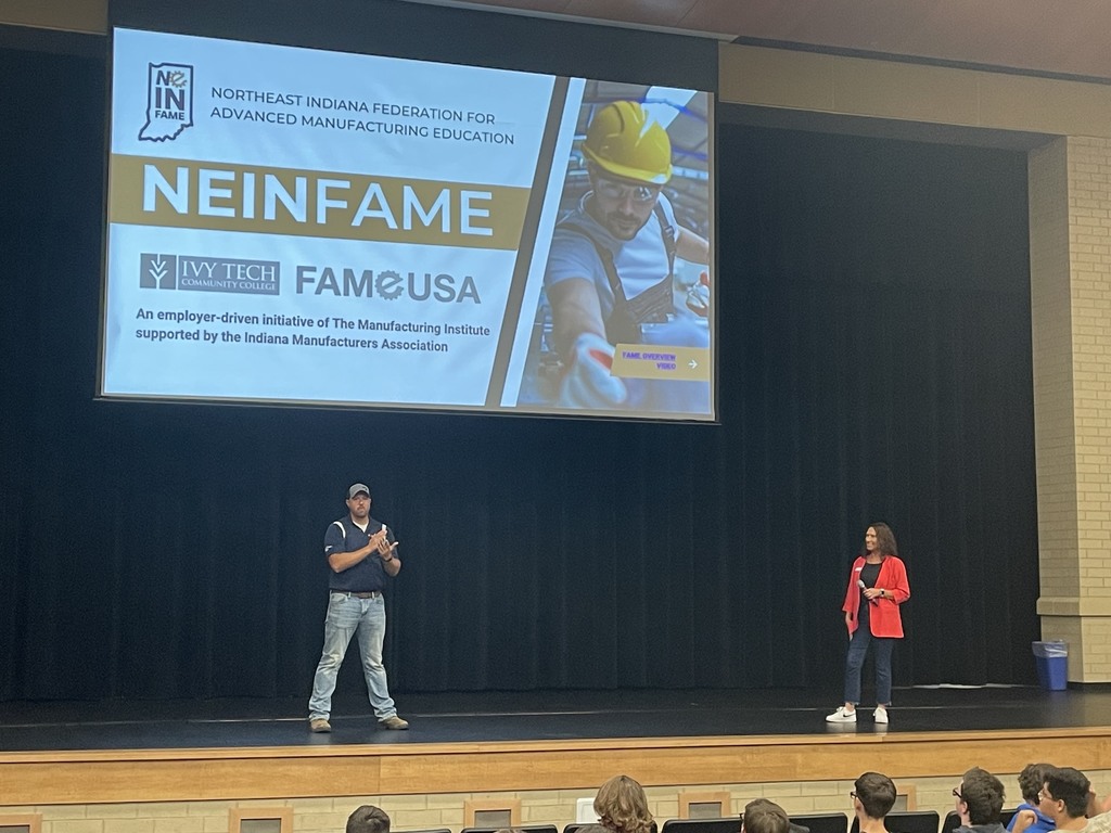 Wes Wolfe, left and Chloe from SDI stand on stage