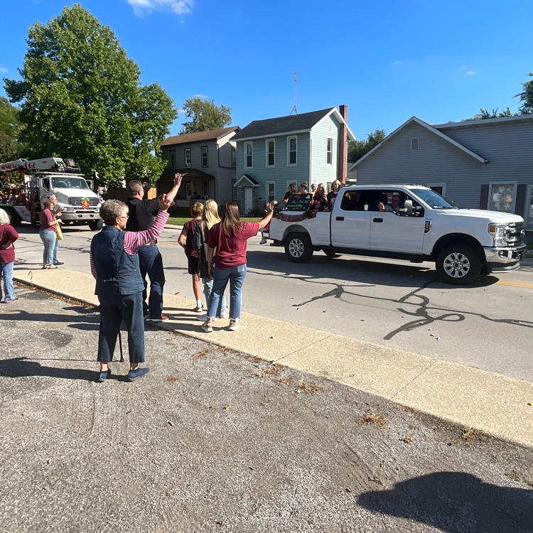 Crowd waves to parade