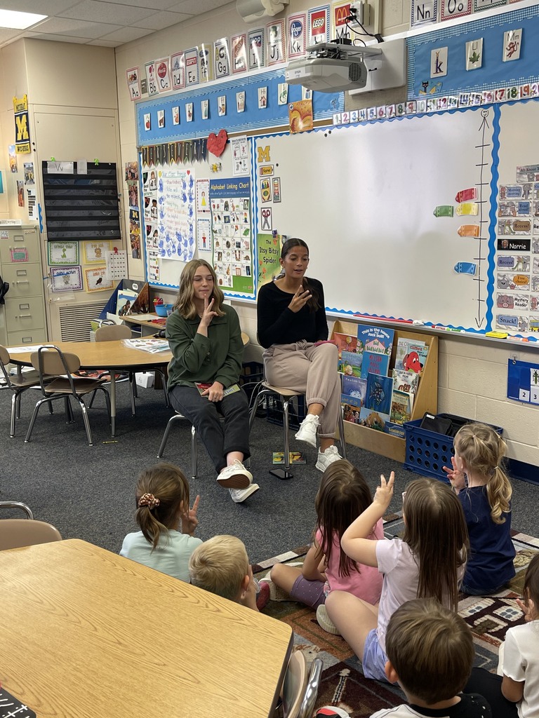 students teach elementary students sign language